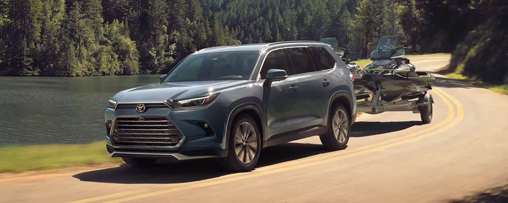 A 2024 Toyota Grand Highlander hybrid hauls two jetskis