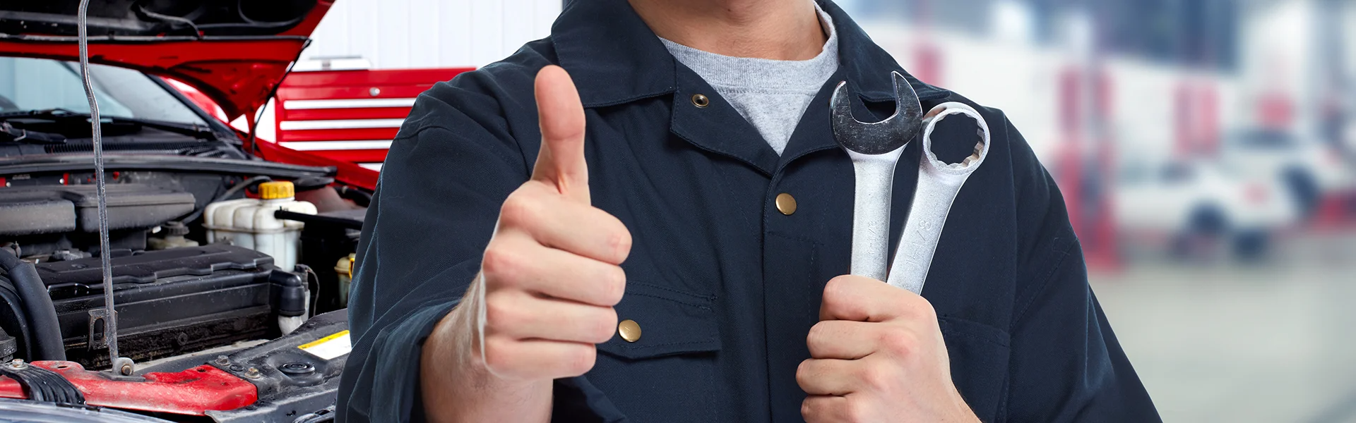 A mechanic gives a thumbs up