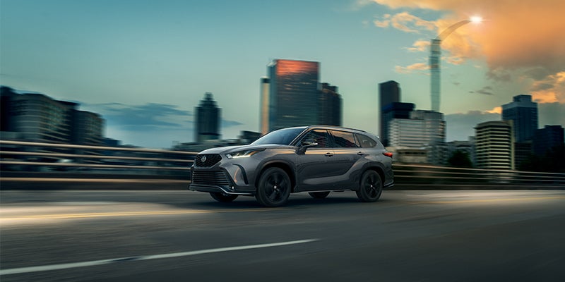 Exterior view of Highlander driving on highway