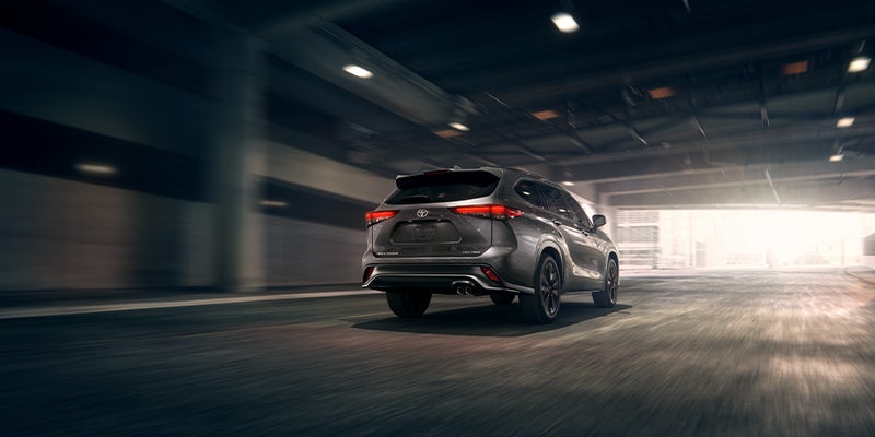 View of rear exterior of Highlander driving