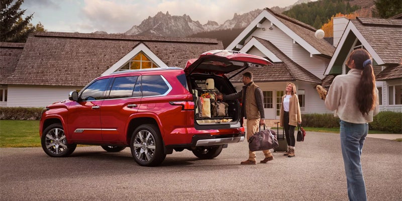 Exterior view of red Sequoia with trunk door open