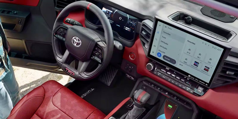 Interior view console and steering wheel with red seat