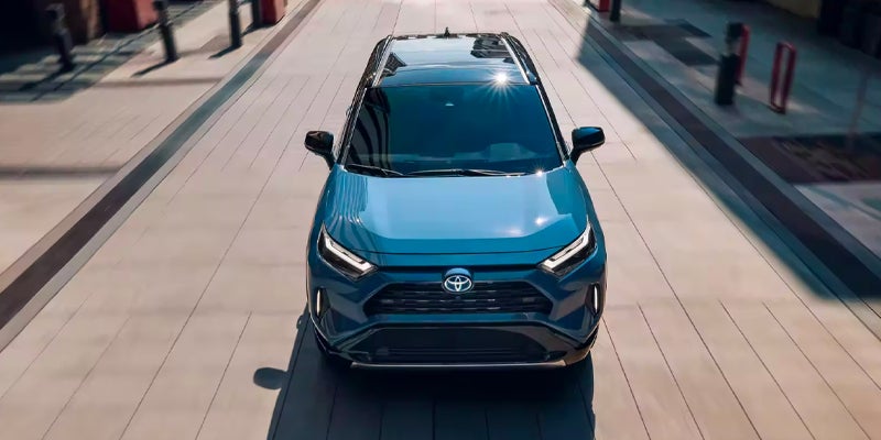 Front overhead view of a blue 2024 Toyota RAV4 Hybrid