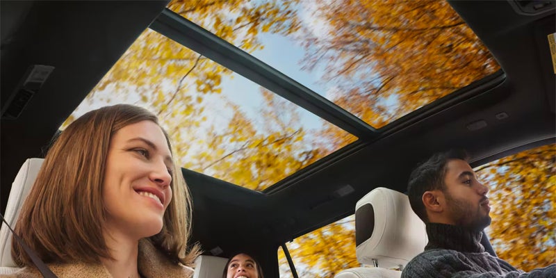 Interior view of a family enjoying the sunroof