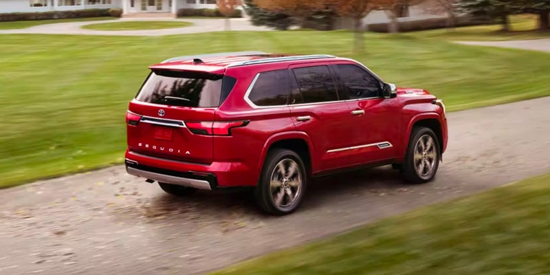 Side rearview of a red 2024 Toyota Sequoia