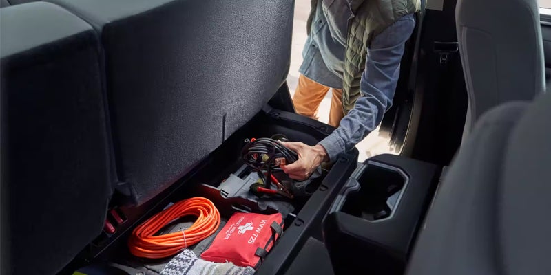 Interior view of storage underneath rear seats